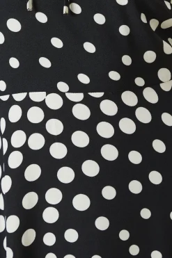 Black Spot tie front hanky hem dress