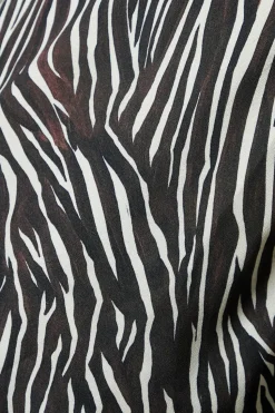 Zebra lace front long sleeve blouse